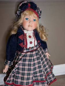 lot 811 image: Doll with Blonde Hair Blue Eyes Navy Jacket Plaid Skirt