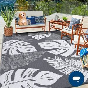 lot 18207 image: Garvee Outdoor Grey & White 9x12 Rug Waterproof Reversible Outdoor Plastic Straw Rug Tropics Palm Leaves Patio Rug Indoor Outdoor Carpet RV Mat for Deck Backyard Patio RV Camping Beach - Retail $65