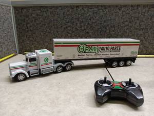 lot 100 image: World Tech Toys OReilly Auto Parts Remote Control Truck Trailer 27MHz