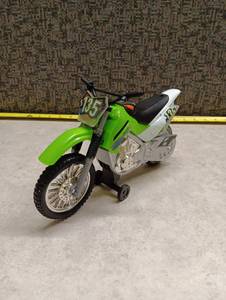 lot 101 image: Toy Motocross Dirt Bike Model Number 135 Green White