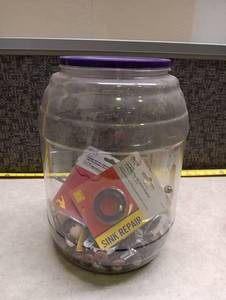 lot 210 image: Clear Storage Jar full of knick knacks