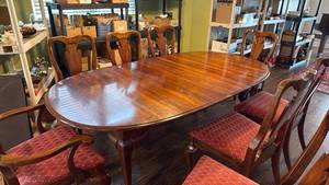 lot 902 image: Wood dining table with 2 arm chairs and 6 chairs 29x80x44 (leaves includes), 2 leaves 10inches each