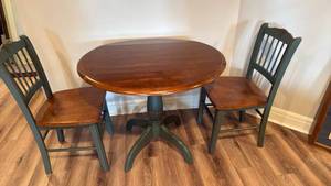 lot 912 image: Drop leaf table29x35 dia with 2 chairs 34x17x16 seat 18 located in basement chairs34x17x16 seat 18
