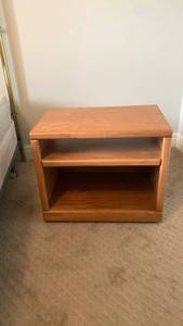 lot 929 image: Wood Night or TV stand with 2 Shelves on wheels 22X26x16 located in basement