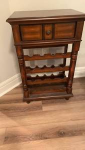lot 932 image: Wooden Wine Rack Cabinet with Storage Drawer  32X20X14 located in basement