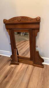 lot 934 image: Vintage Wall-Mount Mirror with Carved Wood Frame 36X31 located in basement