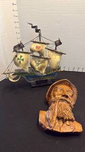 lot 1054 image: Mayflower ship replica 10 inches tall and wall plaque man with pipe