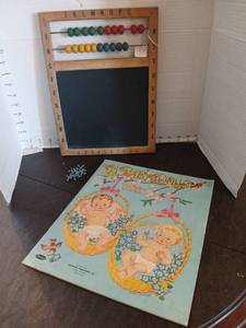 lot 1162 image: Baby Dolls Paper Doll Book with double sided Abacus Frame Chalkboard and jaxxs