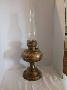 lot 1184 image: Oil Lamp with Clear Glass Chimney and Metal Base 21in.