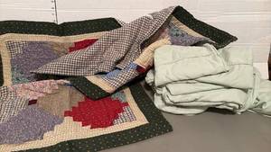 lot 1411 image: Patchwork quilt style pillow shams and a set of sheets.  Cant find size, but appear to be Full