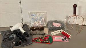 lot 1507 image: Travel hair dryer and lint roller, blowup neck pillow, head massager and more