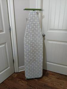 lot 1807 image: Ironing Board with  Cover and Green Metal Stand bag of mixed hangers