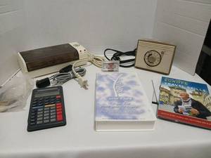 lot 1817 image: Mixed Lot GE Laminator, Texas Instruments Yexas Instrument TI 34Calculator,GE AutomTic Timer, and GE Battery Charger