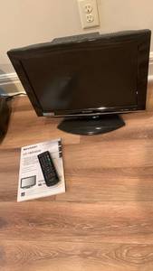 lot 2011 image: Sharp 19 inch TV with built in dvd player - no ac adapter located in basement