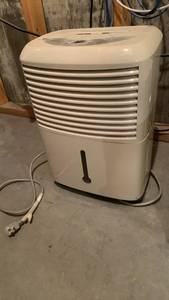 lot 2100 image: GE AHW30LKG1 Dehumidifier 30 Pints 24hr 115V 20 x 13 located in basement