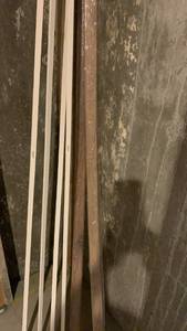 lot 2111 image: Misc Trim Molding Strips Lot White and Brown Toned located in basement