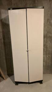 lot 2112 image: Sealyite White Two-Door Storage Cabinet with Black Shelving 68X26X14 located in basement
