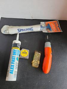 lot 3436 image: Spalding sport pump, acrylic caulk, measuring tape, Black and Decker, power screwdriver.