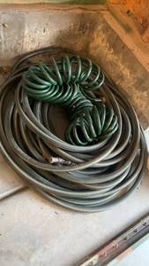 lot 3613 image: Garden Hose Coil with Spray Nozzle Attachment