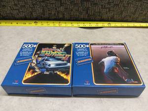 lot 33 image: Blockbuster Cardinal 500 Piece Movie Puzzles Back to the Future II and Footloose Set of 2