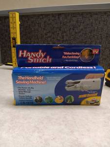lot 55 image: Handy Stitch Handheld Sewing Machine CS-101B Battery Powered