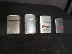 lot 7010 image: Lot of 4 Lighter Lighters with Miller Water Service and Raney Truck Service Advertising