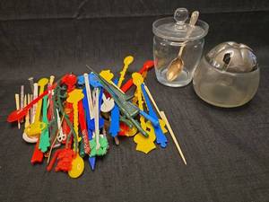 lot 1383 image: Lot of Cocktail Picks Stirrers and Glass Condiment Servers with Lids and Spoons