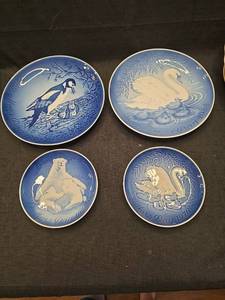 lot 1403 image: Four Decorative Plates with Animal Designs and Year Markings