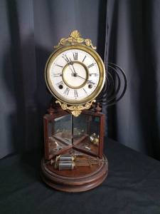 lot 6879 image: The Crystal Palace Clock Solenoid Pendulum Wall Clock