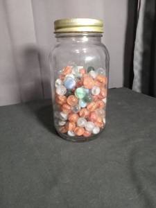 lot 6906 image: Glass Jar with Colored Marbles and Gold Metal Lid