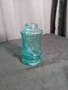 lot 6907 image: Turquoise Glass Jar with Embossed Decoration and Pedestal Base