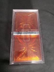 lot 6909 image: Dek-o-Coasters Red and Amber Glass Coasters Set of 2