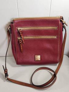 lot 66 image: Dooney &amp Bourke Pebble Grain Leather Crossbody Bag Burgundy Double Zip W Dust Bag