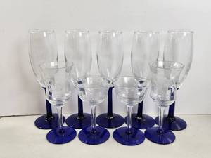 lot 142 image: 9-Piece Glassware Set Blue Stem Base Crystal