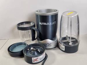 lot 153 image: NutriBullet Blender with Accessories and Extra Cups