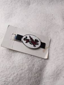 lot 2511 image: Tie Clip with Dragon Emblem Oval White Red Black