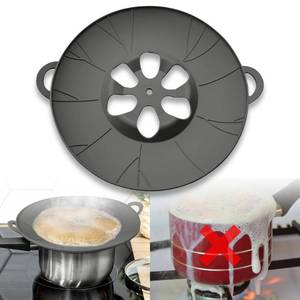 lot 1647 image: Chai, Tea & Milk Boil-Over Spill Stopper Silicone Lid �� Universal Fit for Pots & Saucepans  Food-Safe, BPA-Free, Dishwasher Safe  Heat Resistant up to 520°F - Retail $20