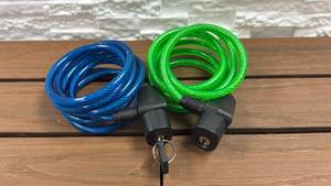 lot 71 image: 2 Pack Coiled Cable Locks (Blue & Green) - Key works for both locks