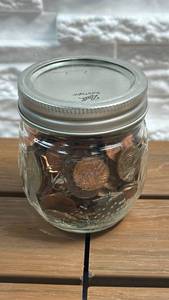 lot 83 image: Ball Mason Jar with Mixed U.S. Coins