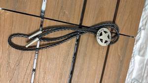 lot 278 image: Leather Braided Rope Bolo Tie with Texas Ranger Star Buckle