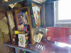lot 3274 image: Entire shelf unit contents only - Vintage military pics, pitcher, glassware and Dale Earnhardt