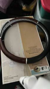 lot 6979 image: Steering Wheel Cover with Wood Grain Trim