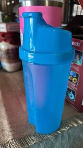 lot 7011 image: Blue Protein Shaker Bottle with Flip Lid and Measurement Markings