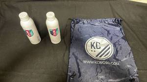 lot 7786 image: KC Still Bottled Water 20 oz 2 Bottles with Drawstring Bag