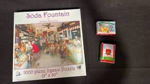 lot 7829 image: Soda Fountain 1000 Piece Puzzle Susan Brabeau 26 x 61