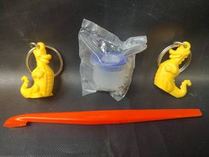 lot 616 image: Vintage Tupperware Key Chains and Orange Peeler