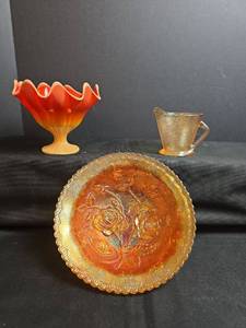 lot 209 image: Orange Slag Glass Pedestal Compote,  Imperial Glass Marigold Carnival Glass Bowl, and Creamer