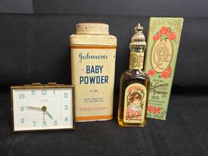 lot 232 image: Collectibles Elgin Clock, Johnsons Baby Powder 10 oz, Avon California Perfume 1976 Keepsake
