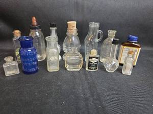lot 267 image: Lot of 14 Small Glass Bottles Jars Vintage Collectible Apothecary Medical