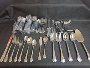 lot 636 image: Pfaltzgraff Flatware and Service Set (89 Pieces)